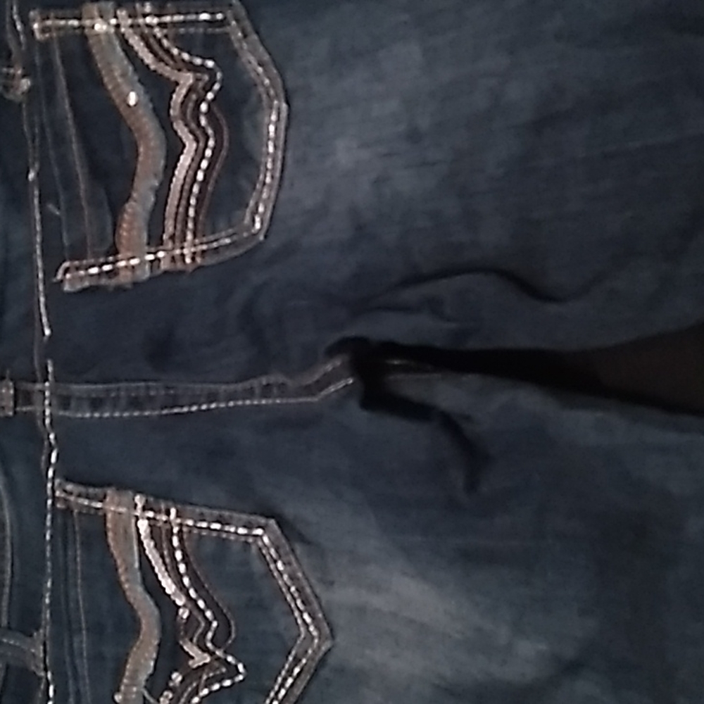 Wallflower bootcut jeans with sequins on front and back pockets.